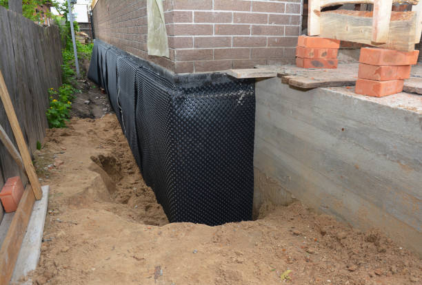 Happy homeowners after waterproofing job in Newberg